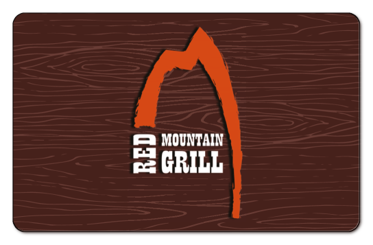 red mountain grill mountain logo on a wood background
